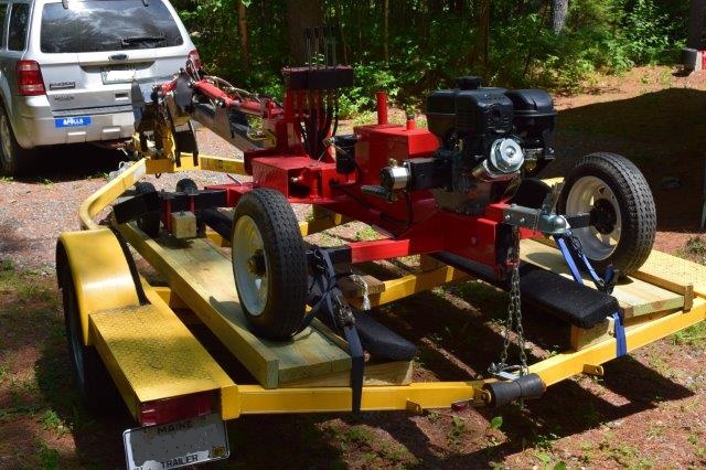 Securing backhoe to trailer