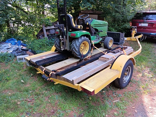 Transporting a tractor on a boat trailer